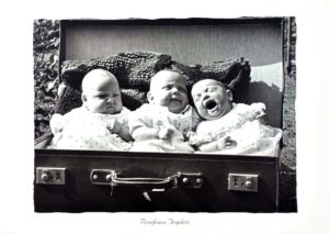 Briefcase Triplets Photographic Print