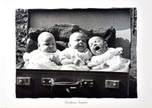 Briefcase Triplets Photographic Print