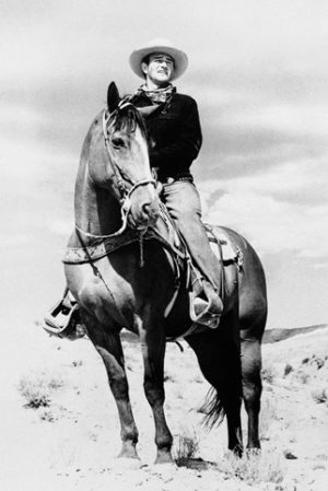 John Wayne On Horseback Poster